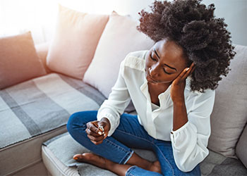 Decisive women taking off wedding ring