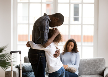 Daughter hugs father who is moving out after divorce